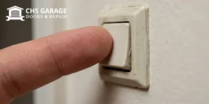 Checking garage door wall button for sticking to fix phantom opening